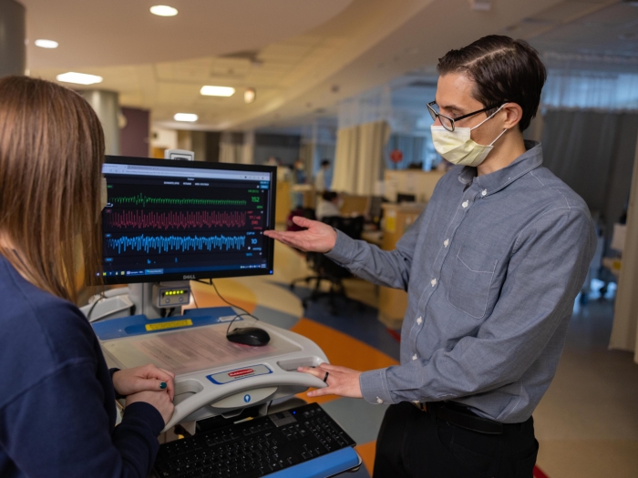 Doctor reading scans in the pediatric unit 