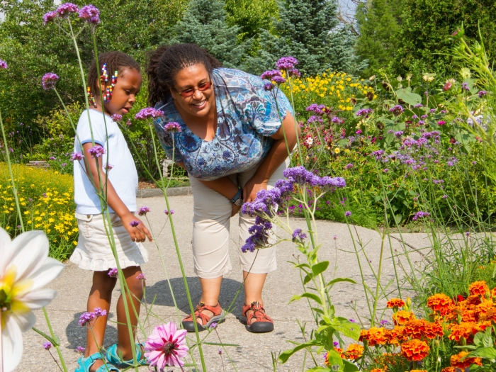 A woman and girls enjoying the gardens