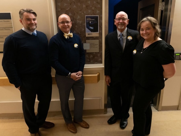 Dr. Martin Tuck (third from left) with son-in-law Ben, son Jeremy, and daughter Alison.