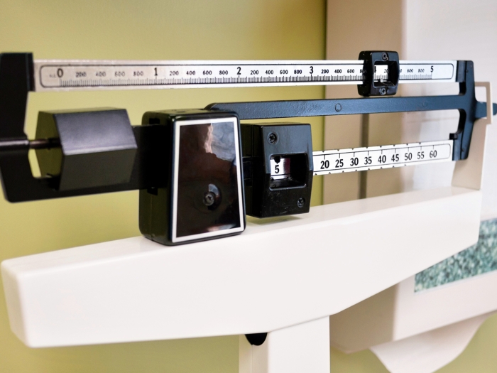 weight scale black white in exam room close up