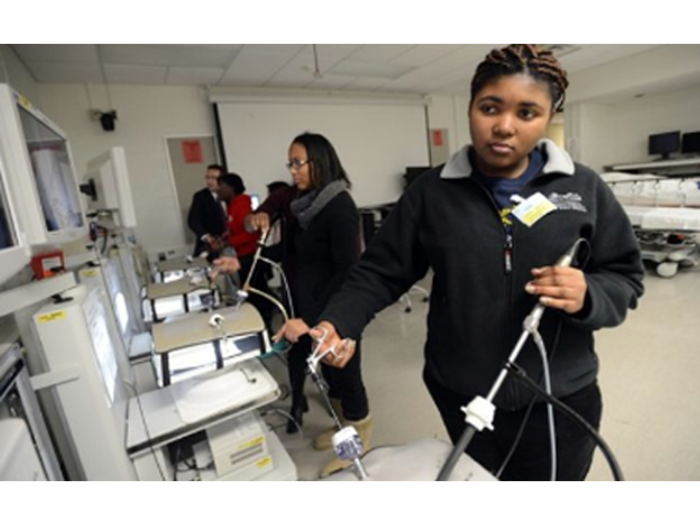 Girl handling some medical/science equipment