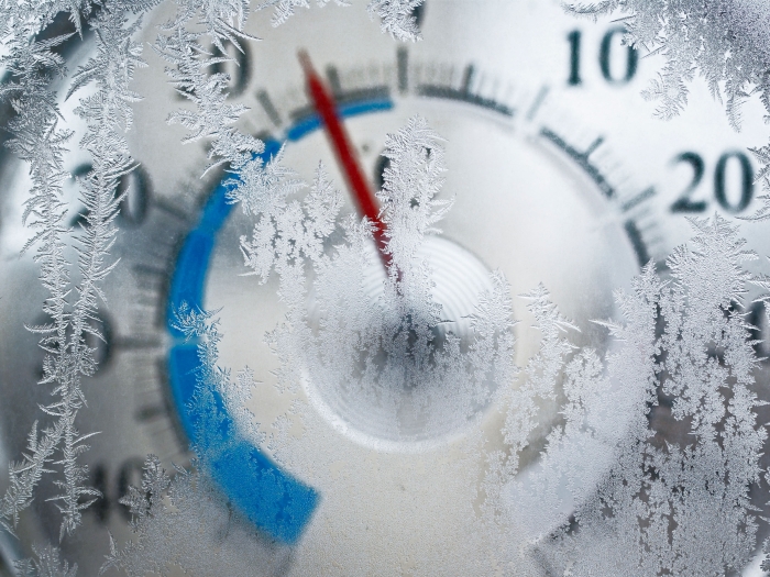 frozen dial with ice on it with red dial