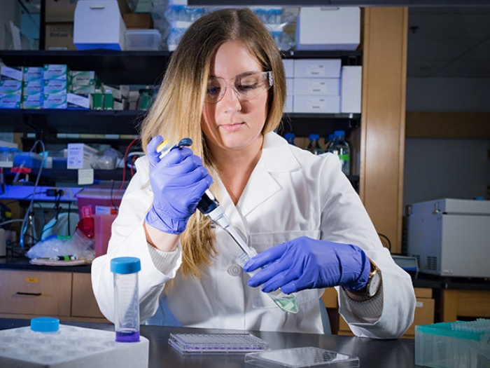 women scientist gloves laboratory vial 