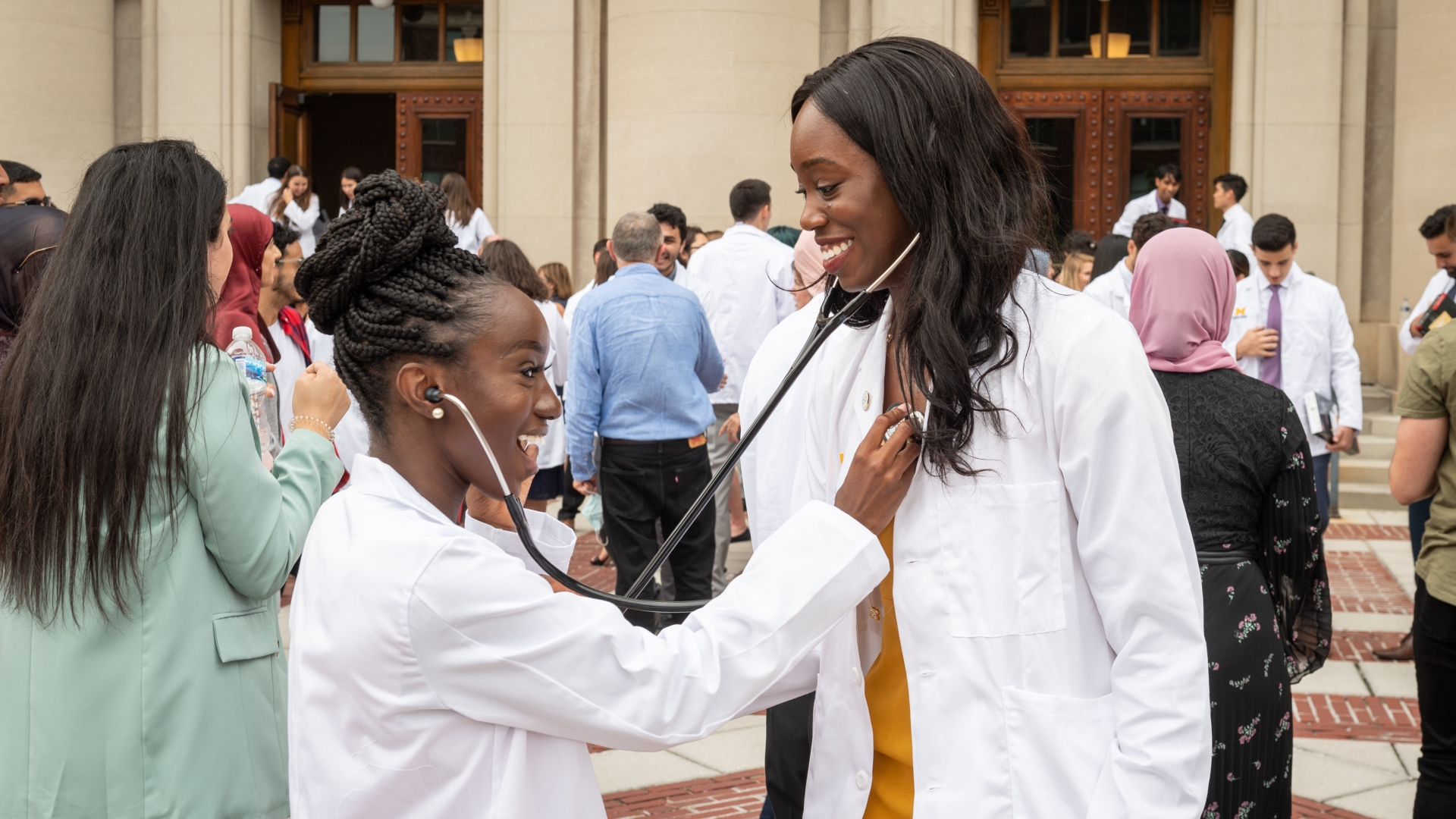 Two people using stethoscopes