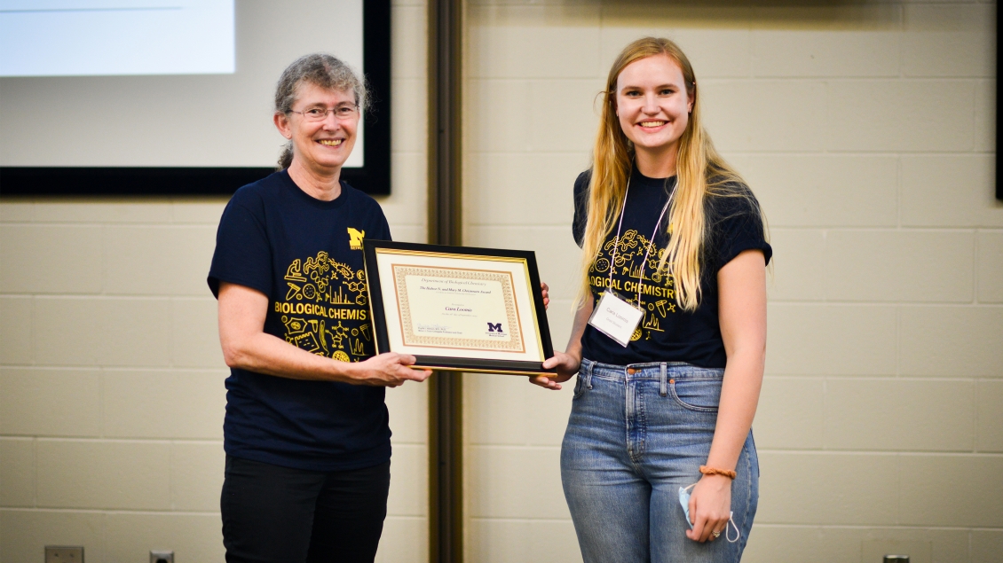 girl relieves the harbor N. and Mary Christensen award from professor 