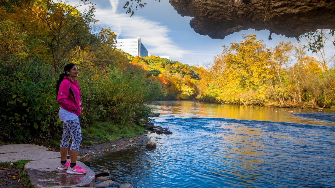 Woman standing at a river side