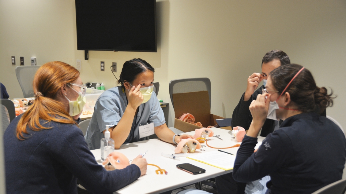 A group of people sitting at a table.