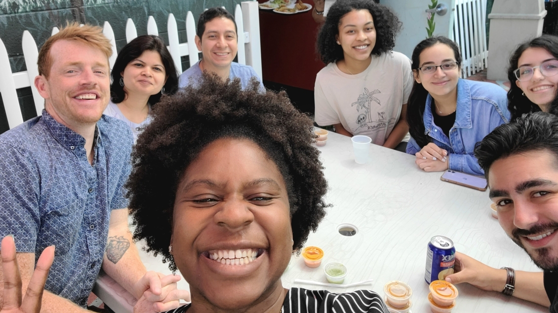 a group of people sitting around a table