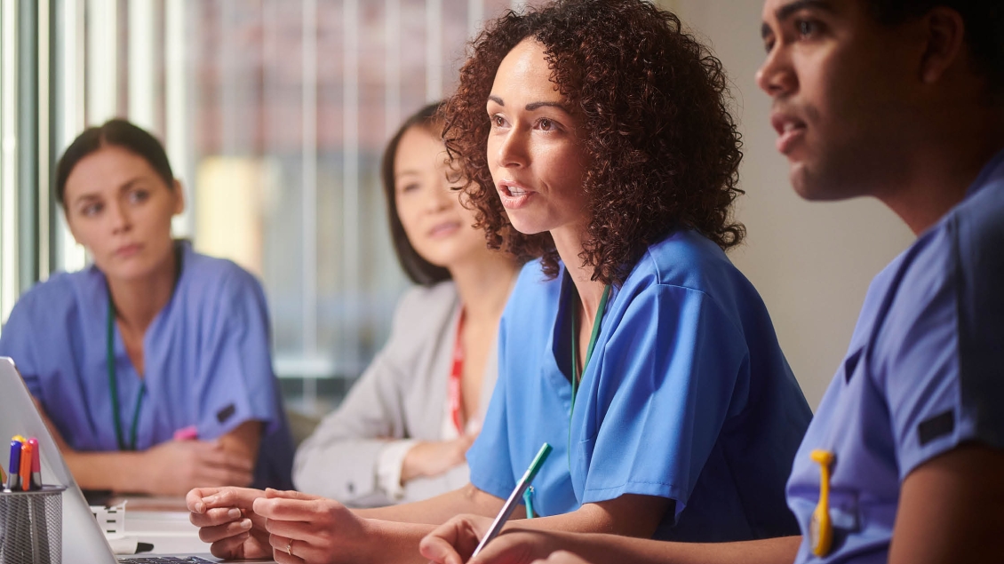 Health care providers hold a meeting