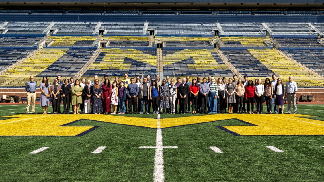 MEND faculty pose for a photo in the big house