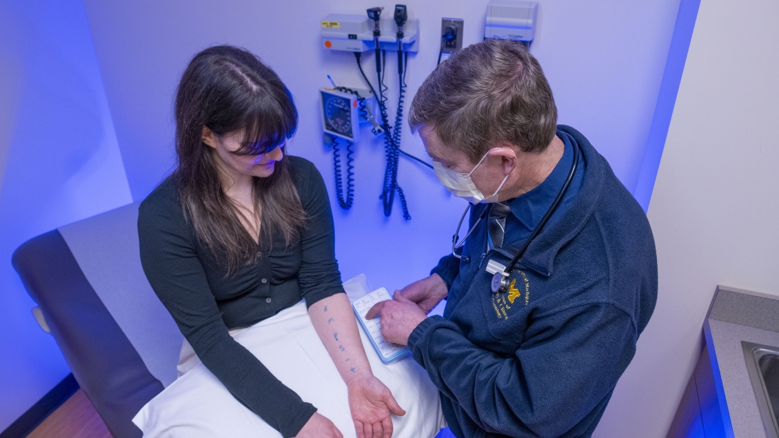 Female patient gets allergy skin test conducted on her arm