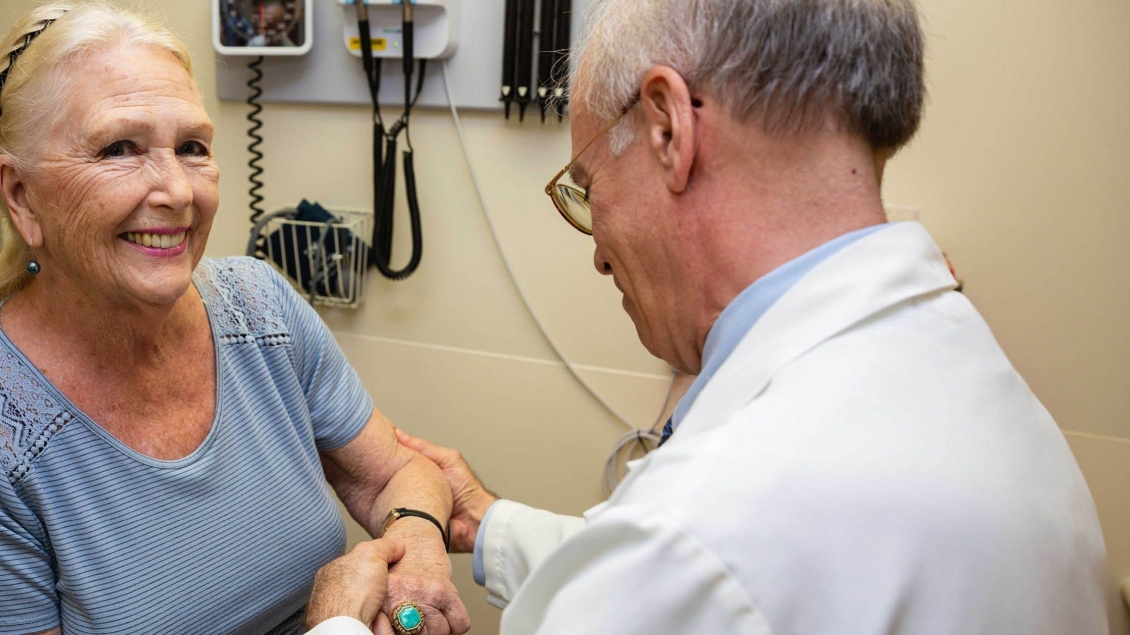 A doctor working with a patient