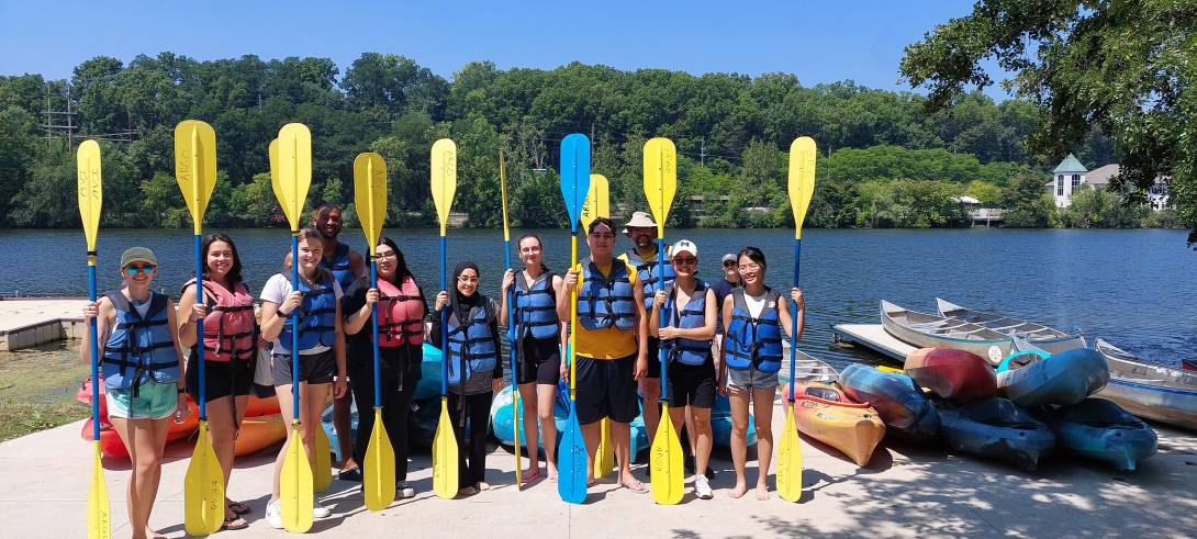 a group of people holding paddles