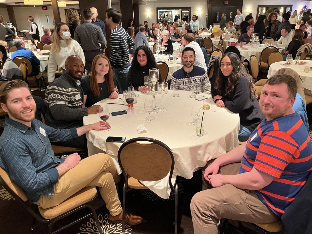 Pharmacology staff smile for a photo at a banquet event