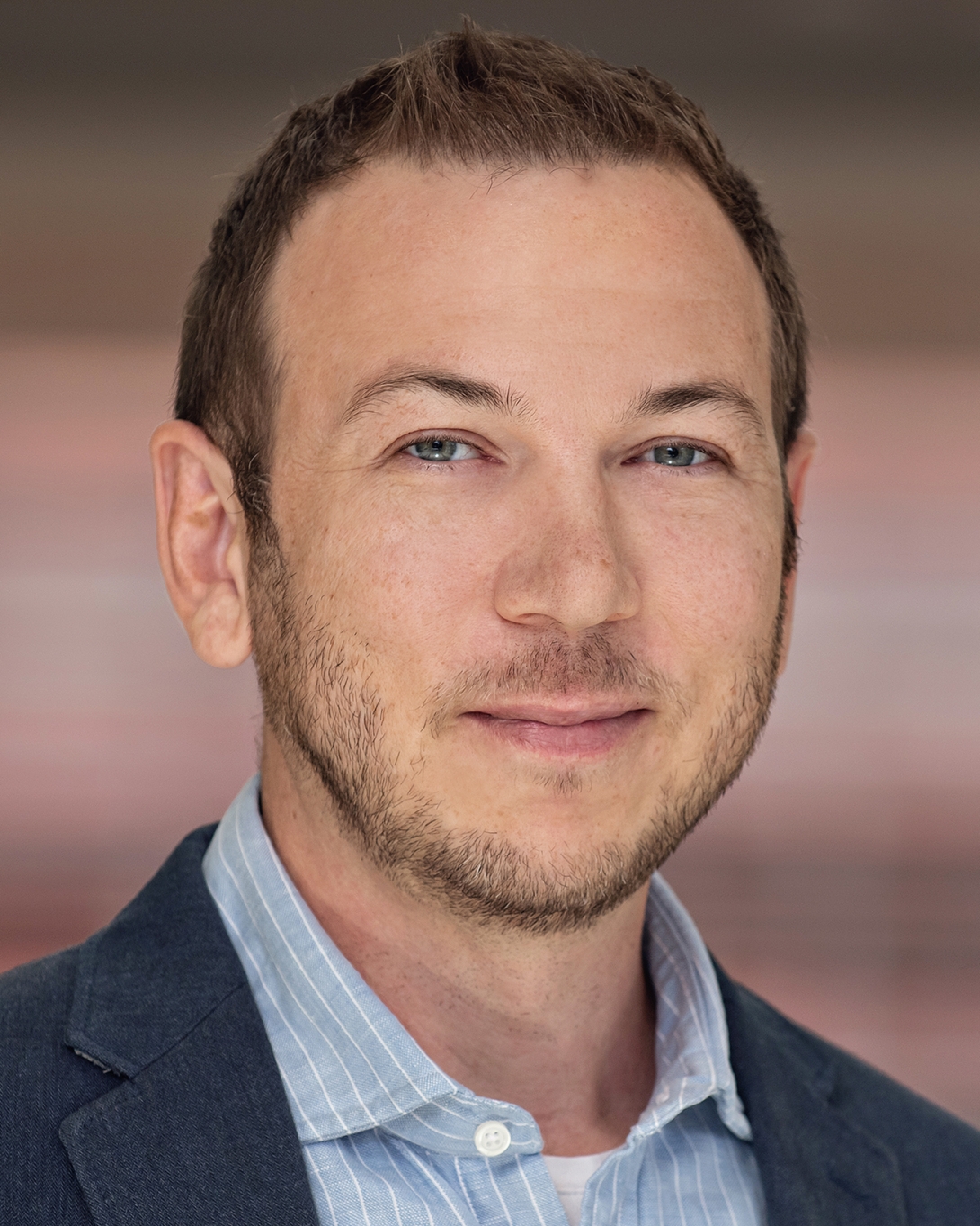 headshot of Adam Courtney